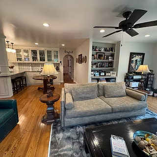 Cottage-inspired kitchen nook and family room after Snyder Atelier transformation